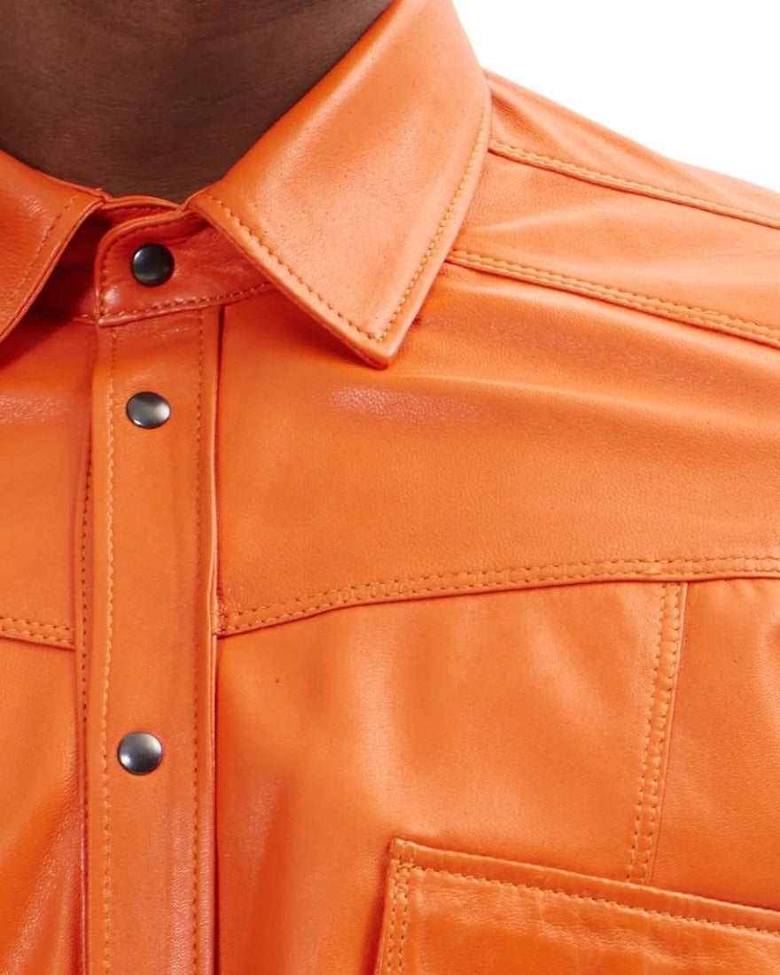 Picture of a model wearing our Orange leather shirt, close up  view.