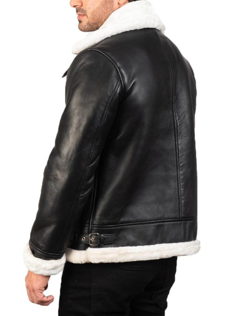 Model wearing Men&#39;s Black Leather Shearling Jacket with white shearling liner. Back view.