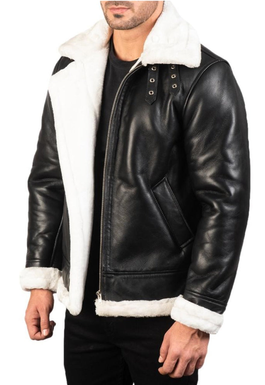 Model wearing our men&#39;s black leather shearling jacket with white shearling liner. Front view not zippped up.
