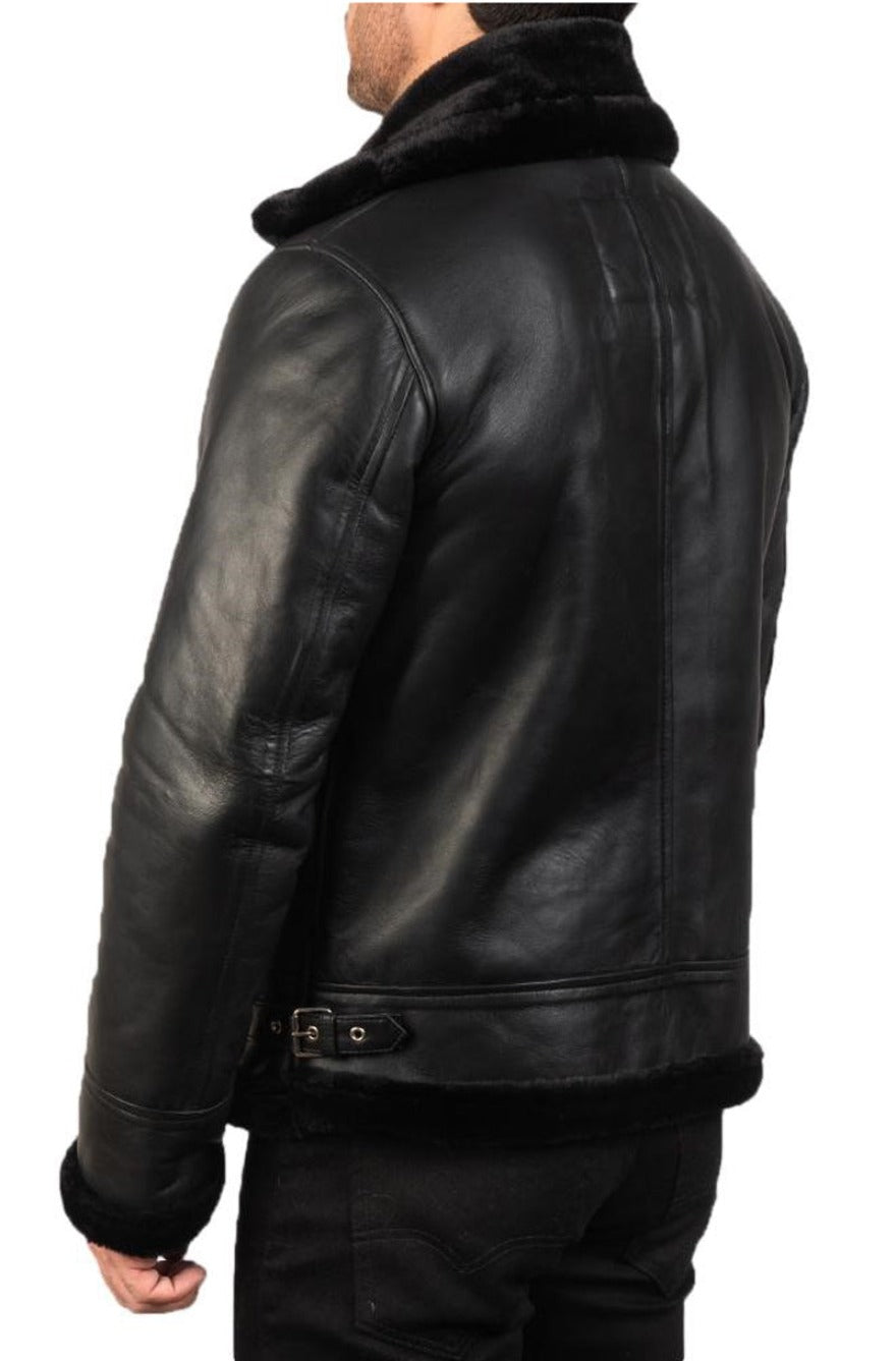 Model wearing Men&#39;s Black Leather Shearling Jacket with black shearling liner. Back view.