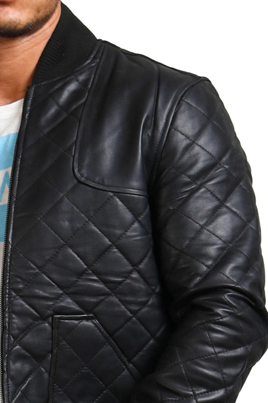 Picture of model wearing our Mens Quilted Leather Jacket in black, diamond pattern, arm close up view.