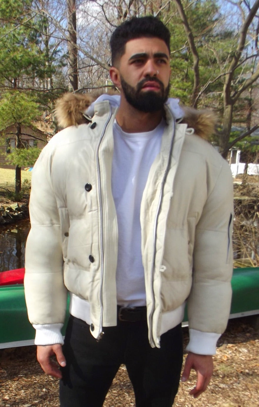 Picture of a model wearing our White Leather Puffer Jacket, front view with zipper open and hood down