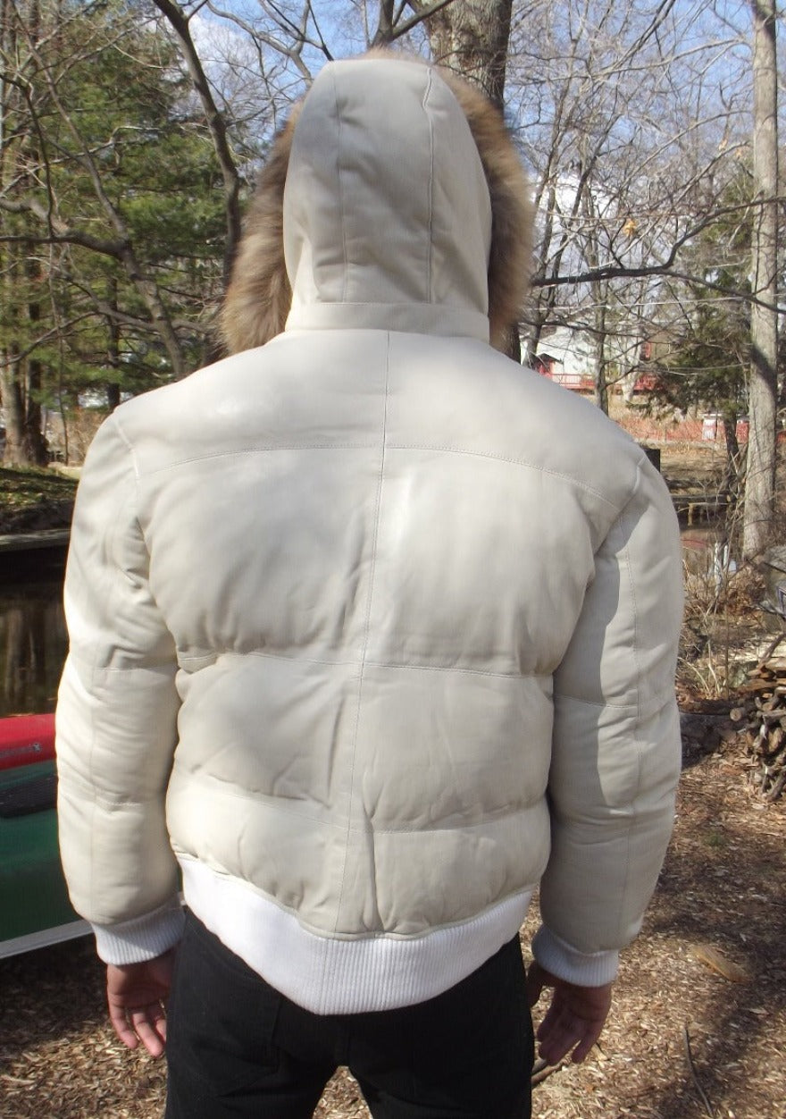Picture of a model wearing our White Leather Puffer Jacket, back view with hood up.