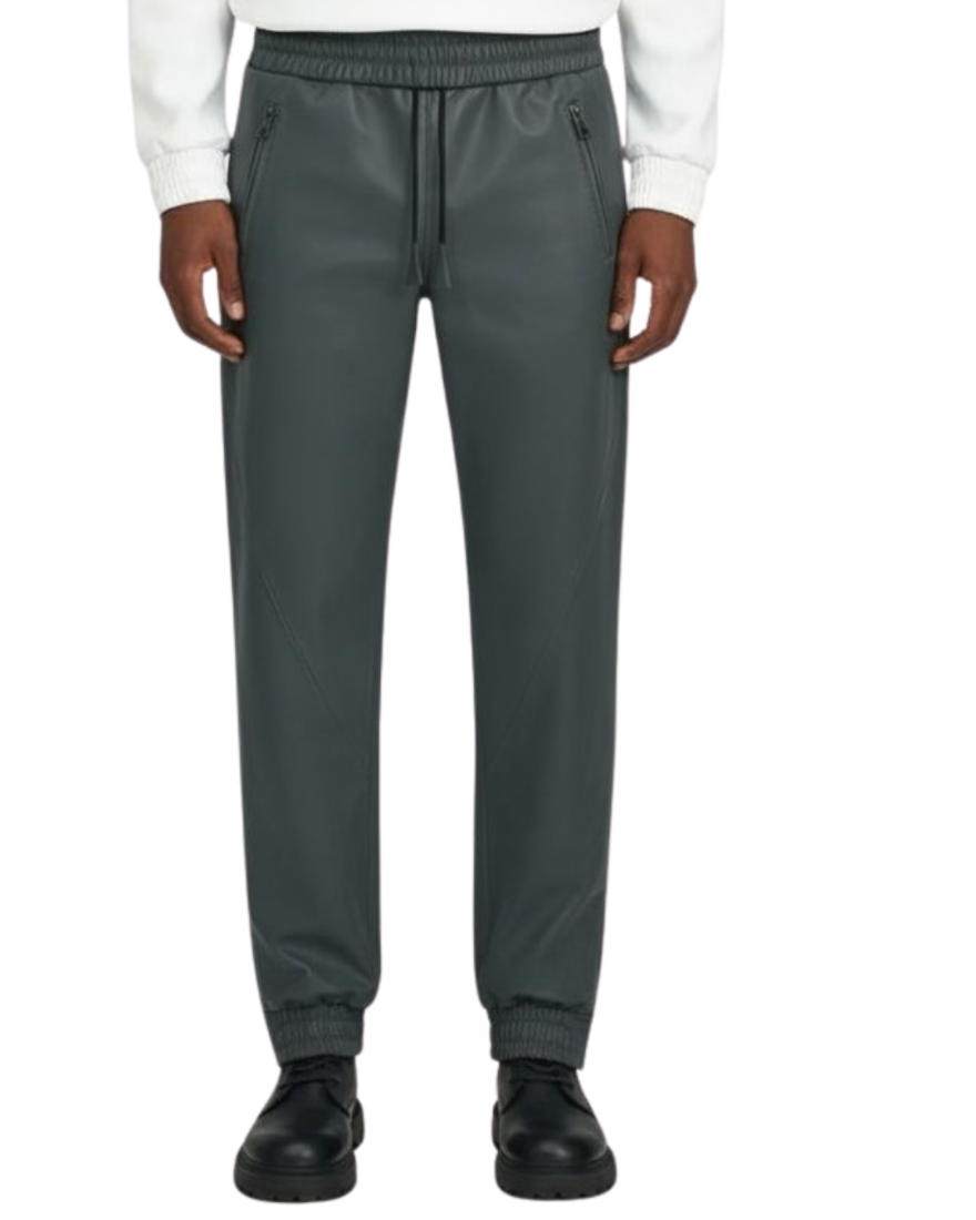 Person wearing grey leather joggers on a white background, front view