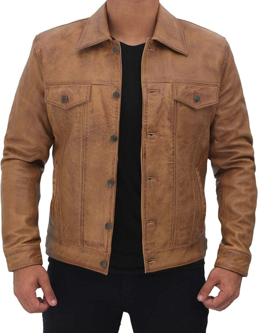 Picture of a model wearing our tan leather trucker jacket, front view with buttons open..