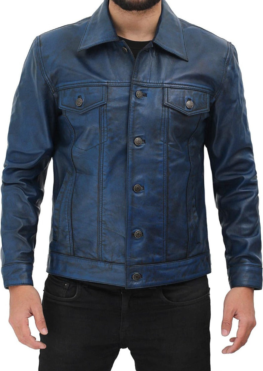 Picture of a model wearing our blue leather trucker jacket, front view., with buttons closed.