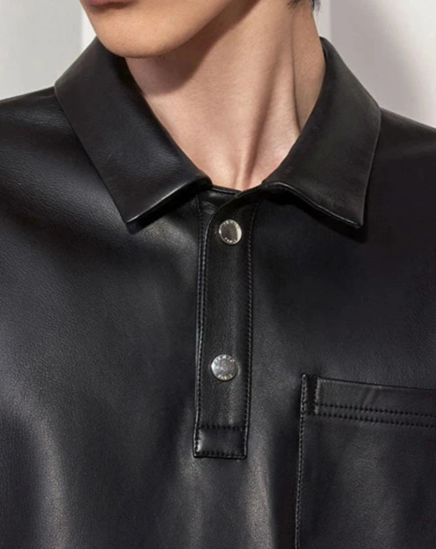 Picture of a model wearing our Mens Black Leather Polo Shirt, close up view.