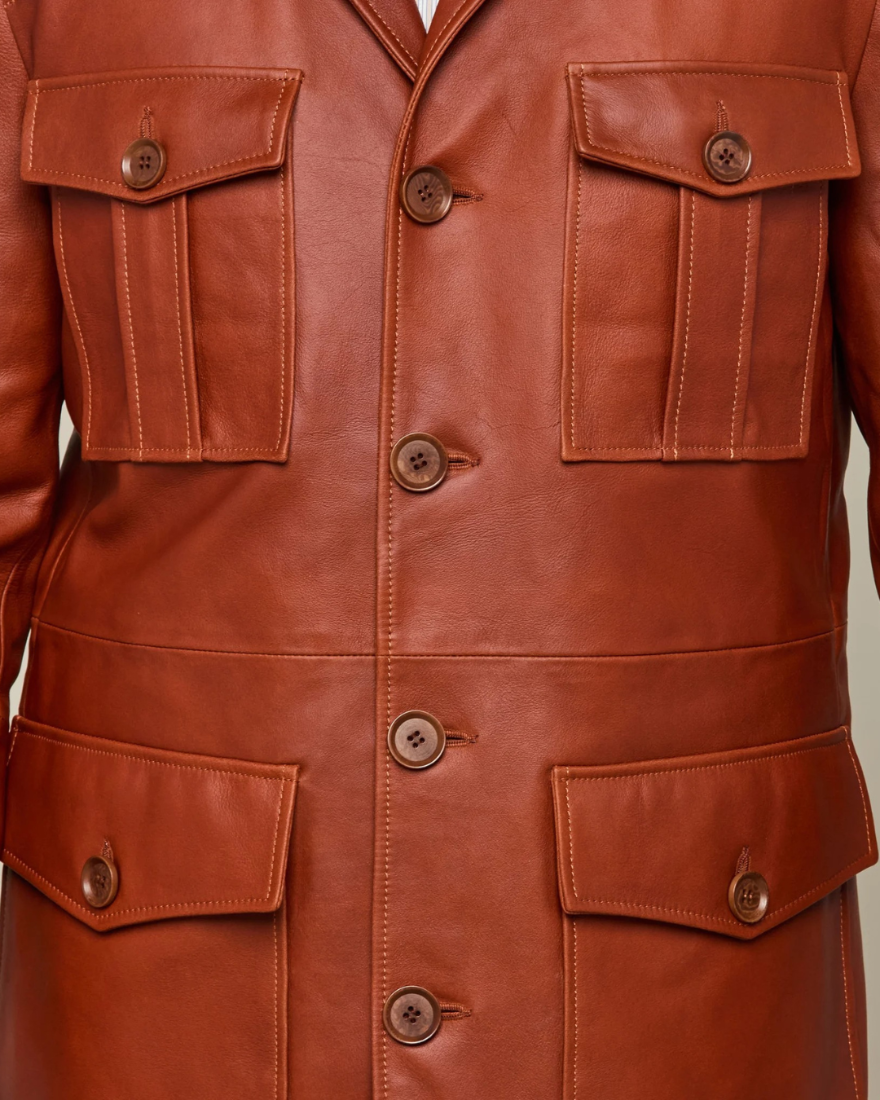 Picture of a model wearing our Leather cargo Jacket, brown color, close up front view.