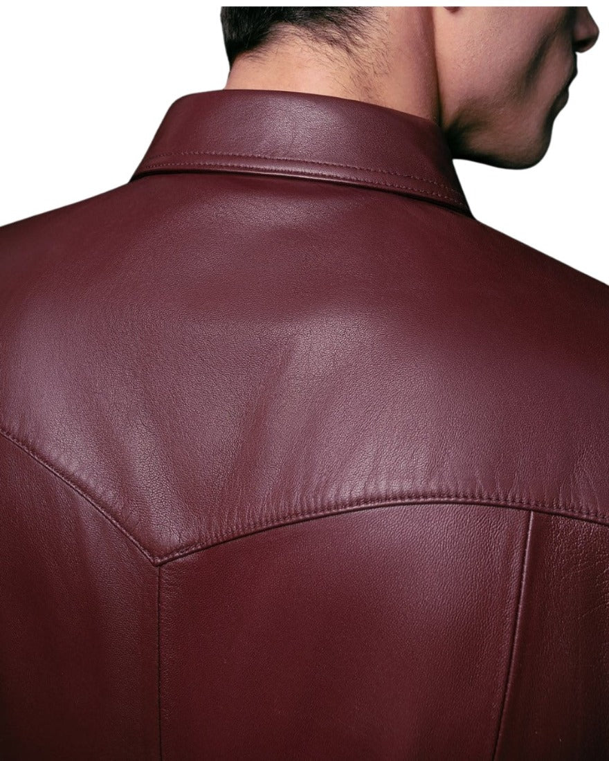 Picture of a model wearing our dark red leather shirt, back, close up view.