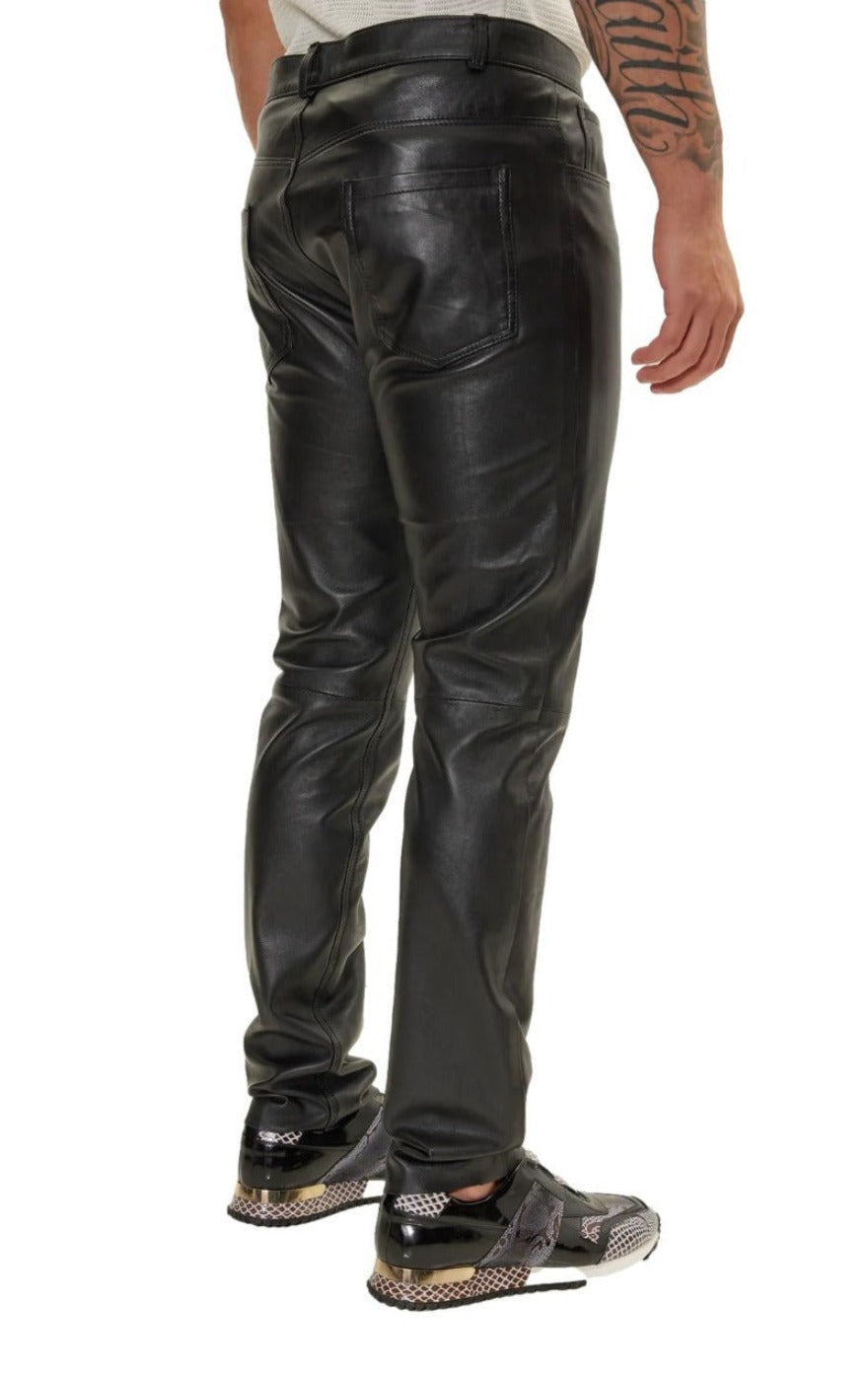 Picture of a model wearing our Black Mens Leather pants side view.