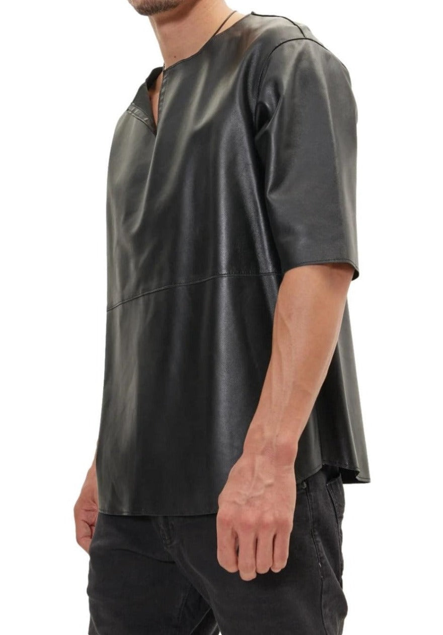 Picture of a model wearing our Mens Black Leather T Shirt, side view.