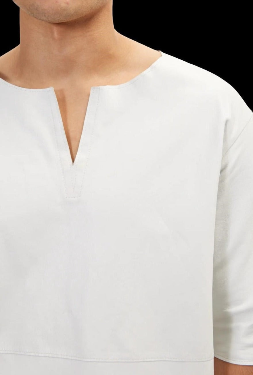 Picture of a model wearing our White Leather T Shirt, close up view.