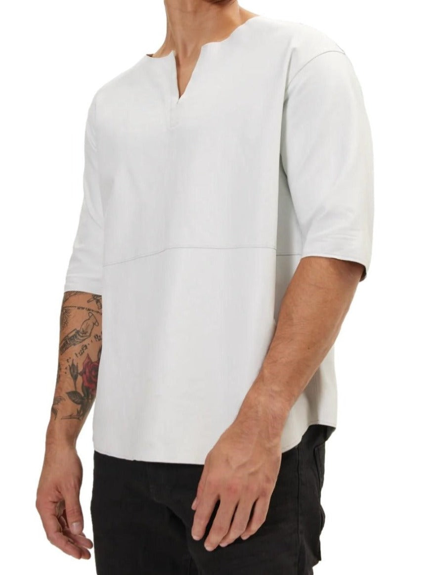 Picture of a model wearing our White Leather T Shirt, side view.