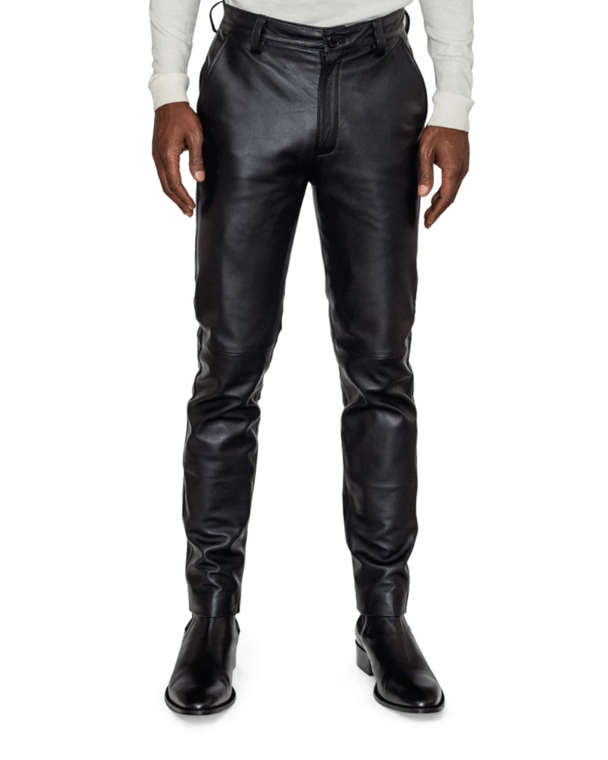 Picture of our black leather suit pants on a model, front view.