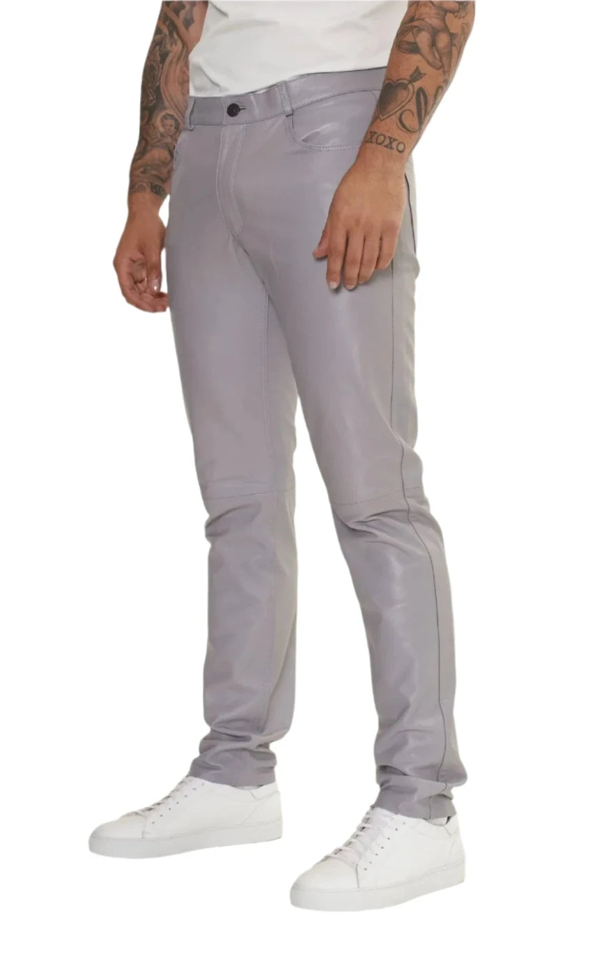 Picture of a model wearing our light grey leather pants. side view