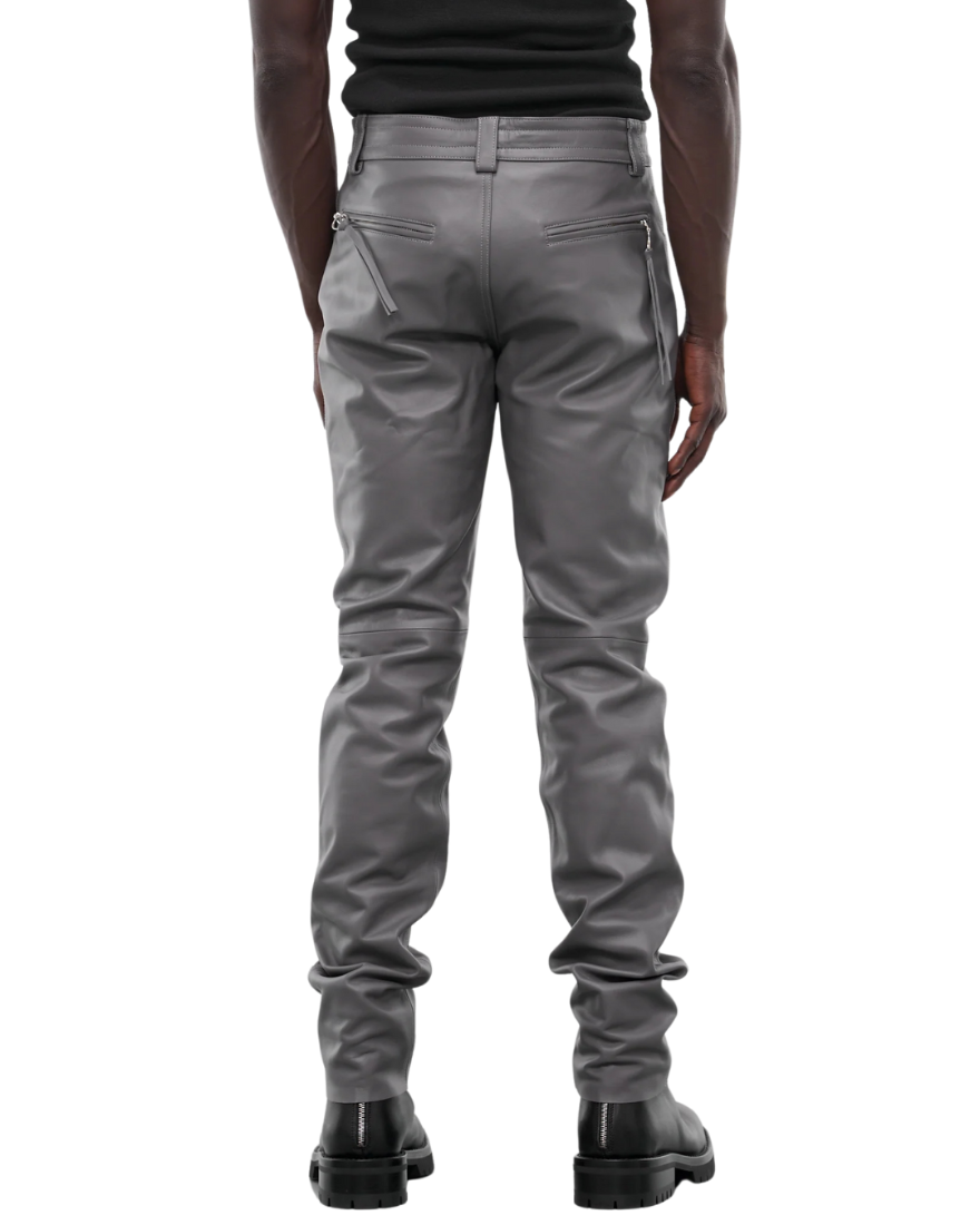 Picture of a model wearing our Light Grey Leather Pants, full back view. 