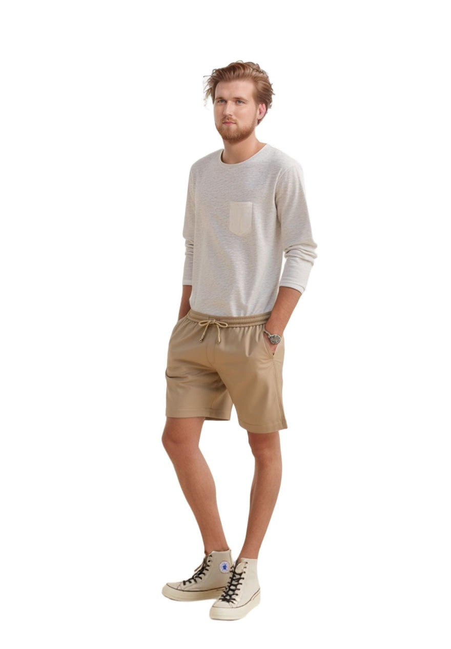 Man wearing a  white shirt and our Men&#39;s Beige Leather Shorts, full size side view.
