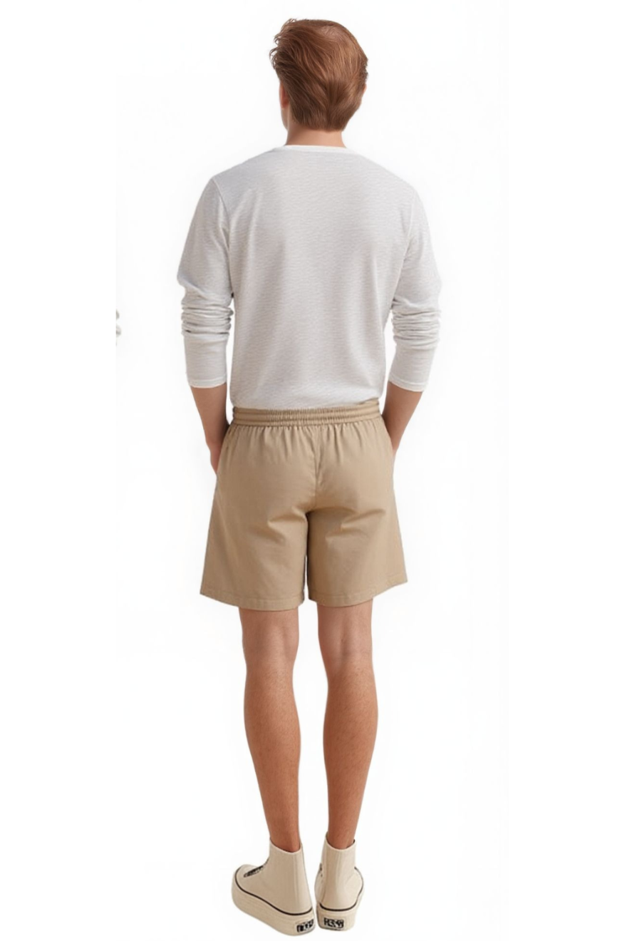 Man wearing a  white shirt and our Men&#39;s Beige Leather Shorts, full size, back view.