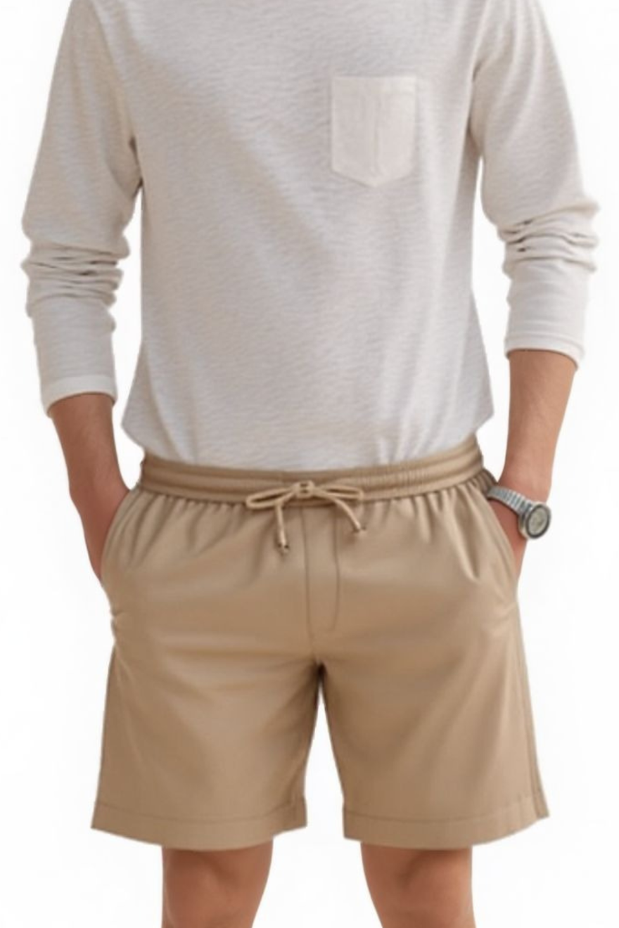 Man wearing a  white shirt and our Men&#39;s Beige Leather Shorts, front view.