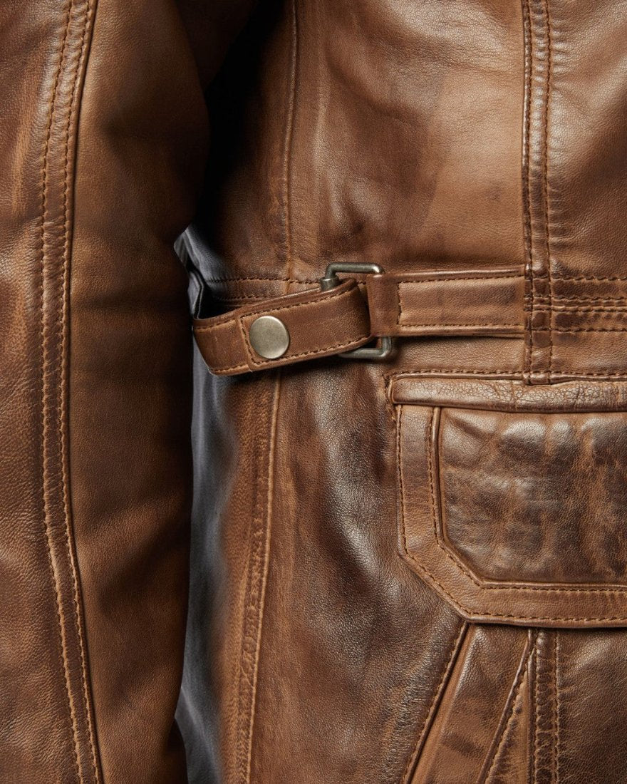 Picture of a model wearing our men&#39;s leather field jacket, close up view of the waist buckle