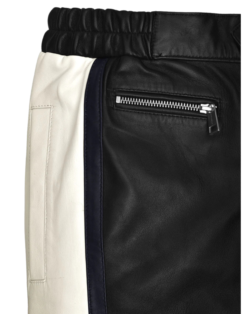 Close up picture of the front waistband of our Mens Black and White Leather Pants, showing the side pocket and zippered pocket.