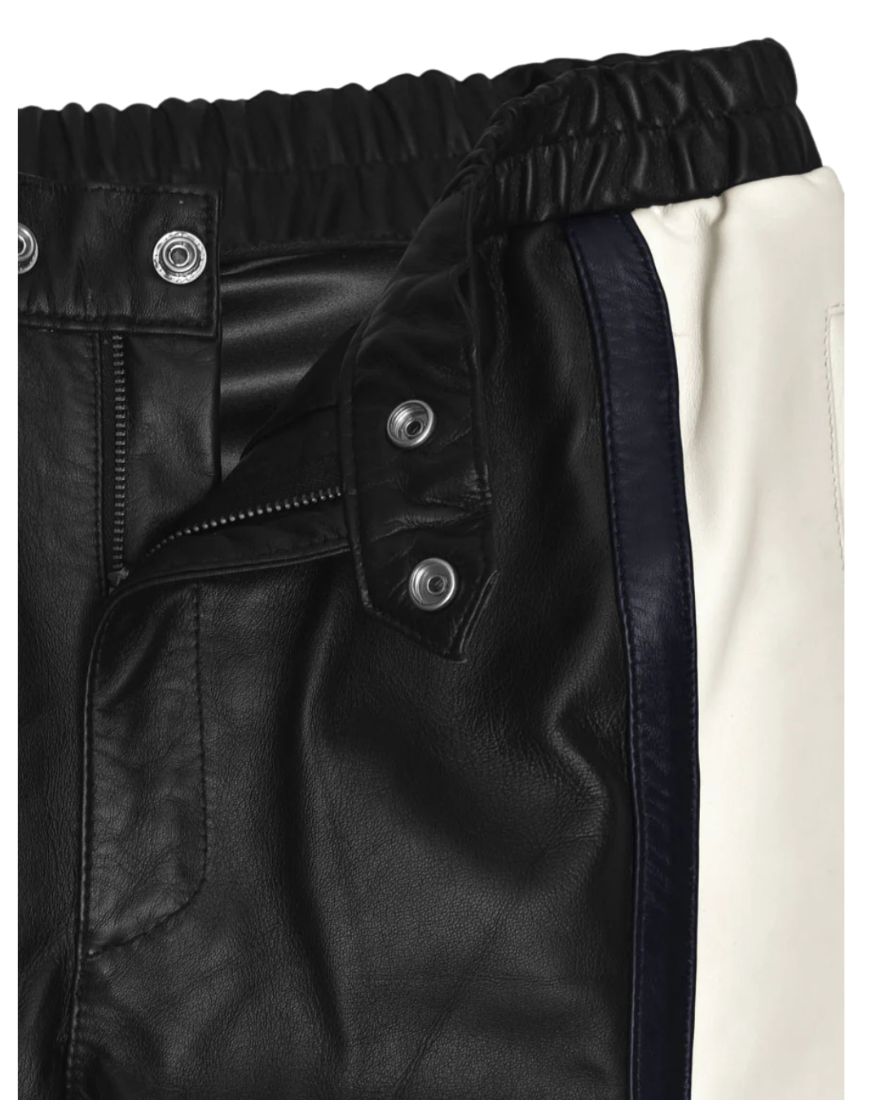 Close up piture of the fly and snap waist closures for our Mens Black and White Leather Pants.
