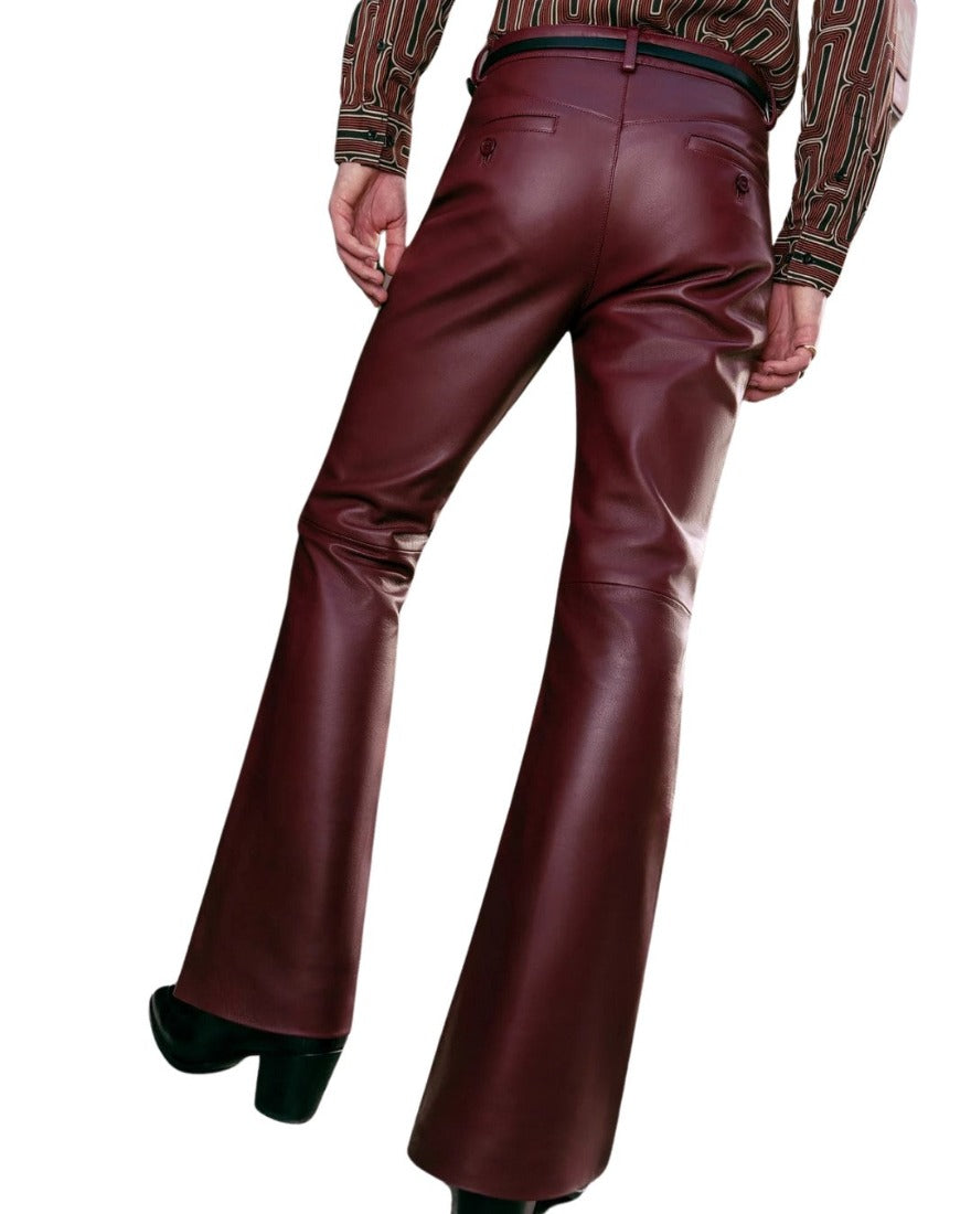 Picture of a model wearing our Mens Maroon Flare Leather Pants, back view.