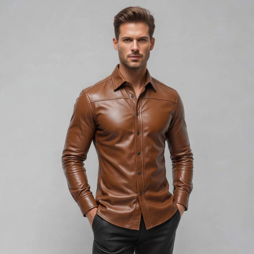 A man wearing our tan leather long-sleeve button-up shirt, posed against a solid gray studio background, front view.
