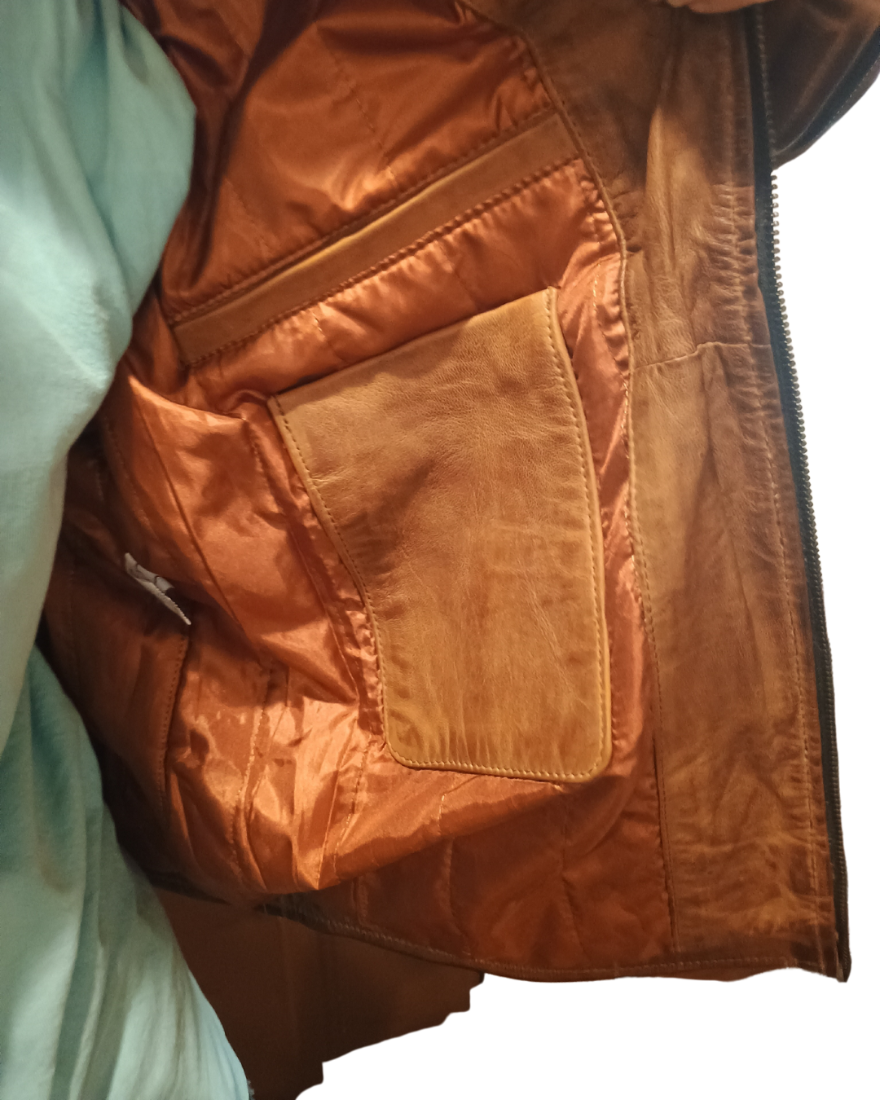 Picture of the lining in our tan leather racer jacket showing 2 inside pockets.