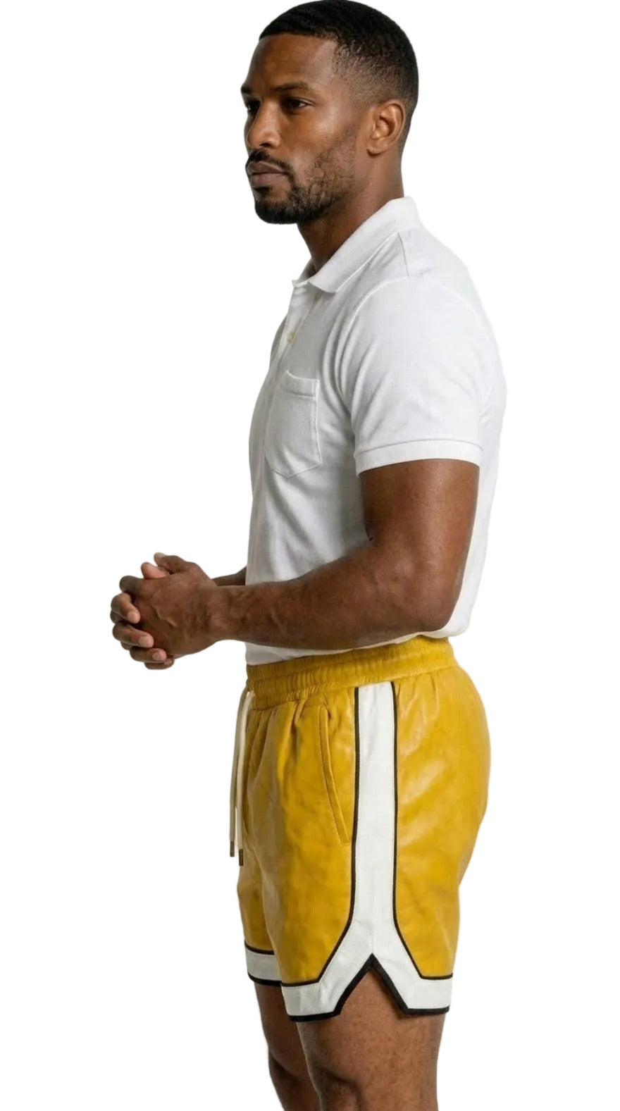 Picture of a man wearing our Yellow Mens Leather Shorts with Contrast Side Stripe and a white polo shirt,  side view.