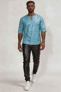 Video of a man wearing our Light Blue Leather T Shirt Mens, walking on a fashion show runway.