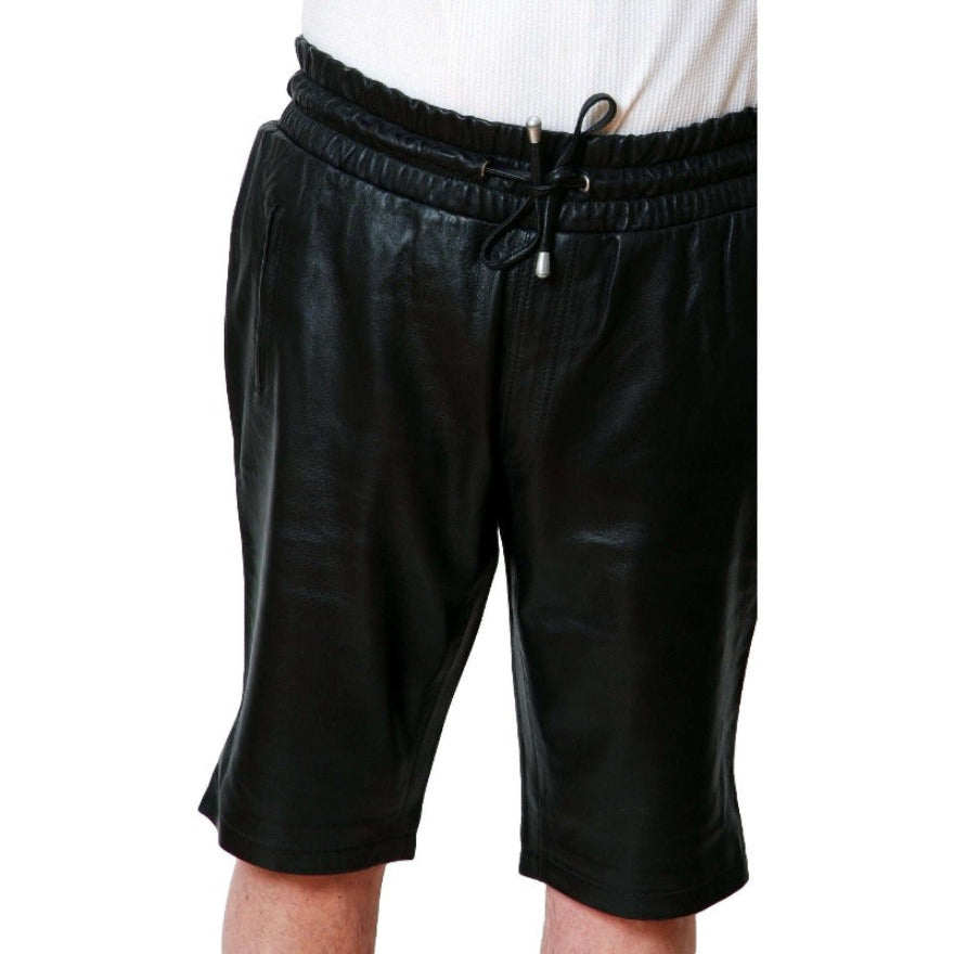 Picture of a model wearing Mens Black Leather Shorts, front view.