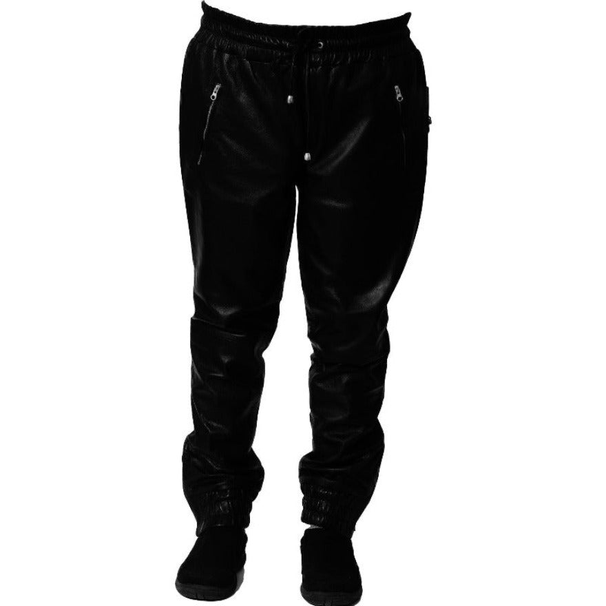 Picture of a model wearing our Mens Black Leather Joggers, front view.
