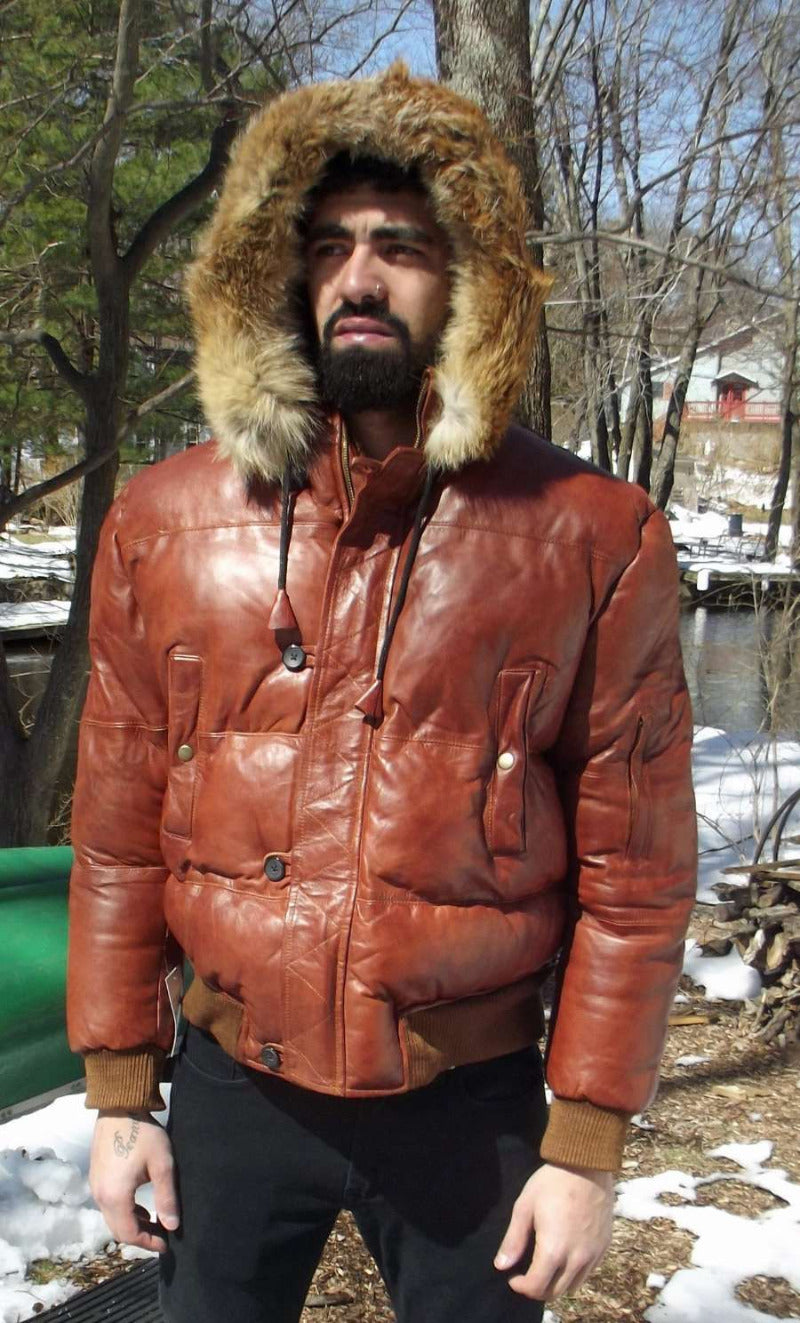 Picture of a model wearing our Brown Puffer Leather Jacket, front view with fur trimmed hood up.