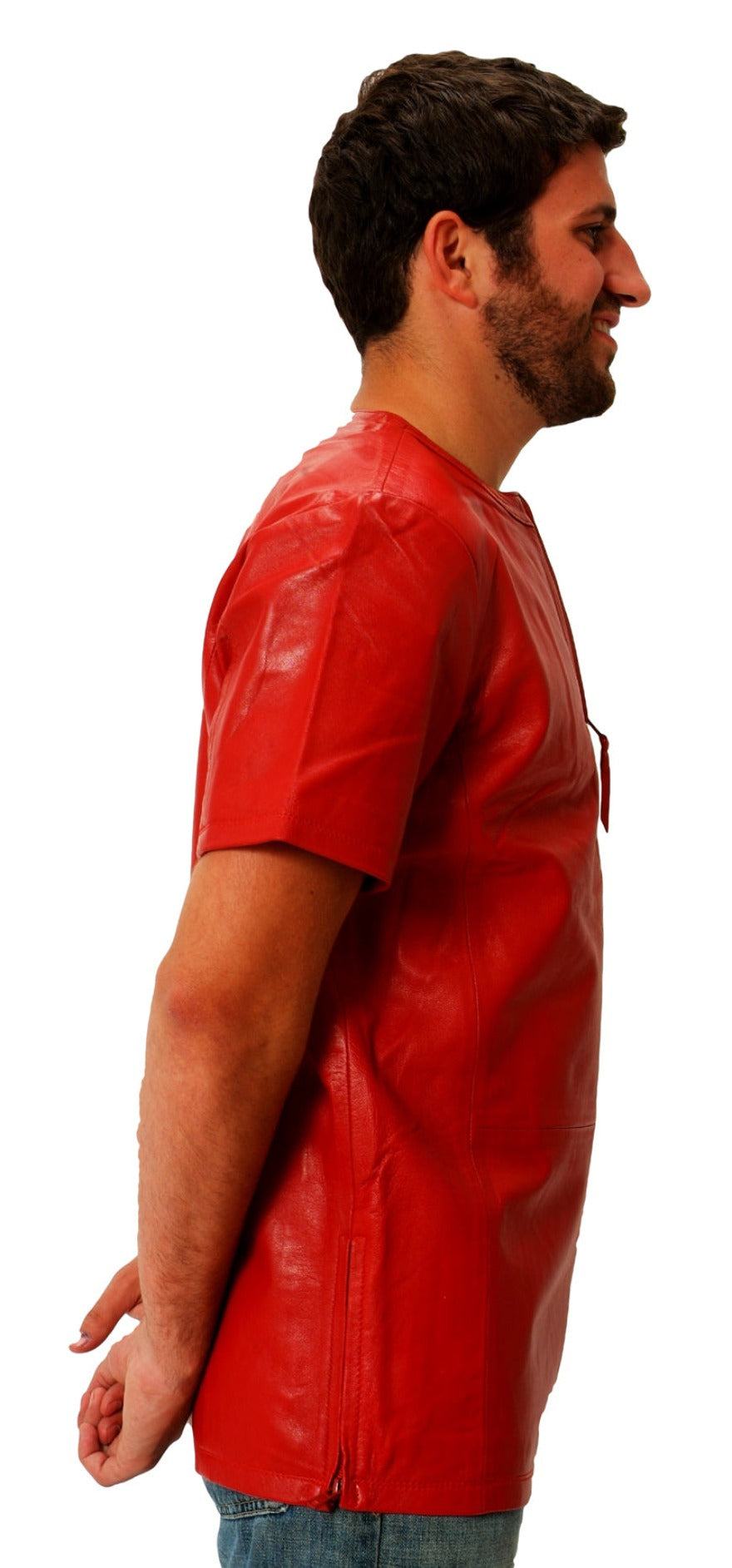 Picture of model wearing a red leather t shirt, side view.