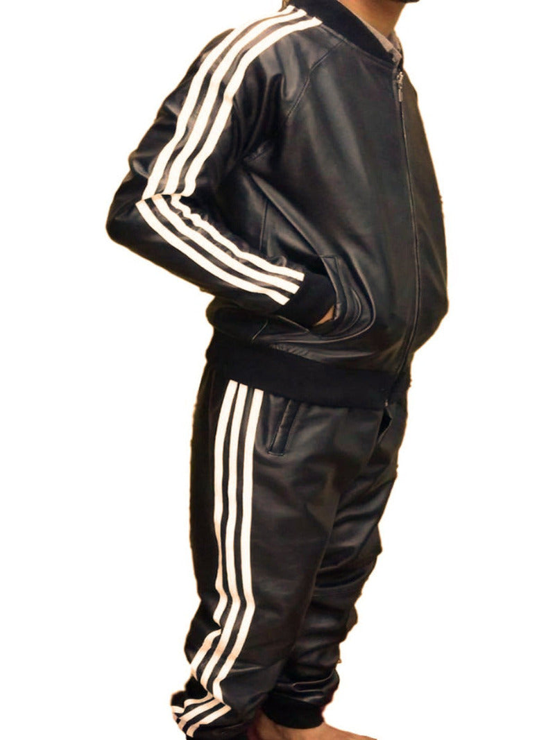 Model wearing mens casual leather jacket and leather joggers in black with 3 stripes on the arm and pant sides.