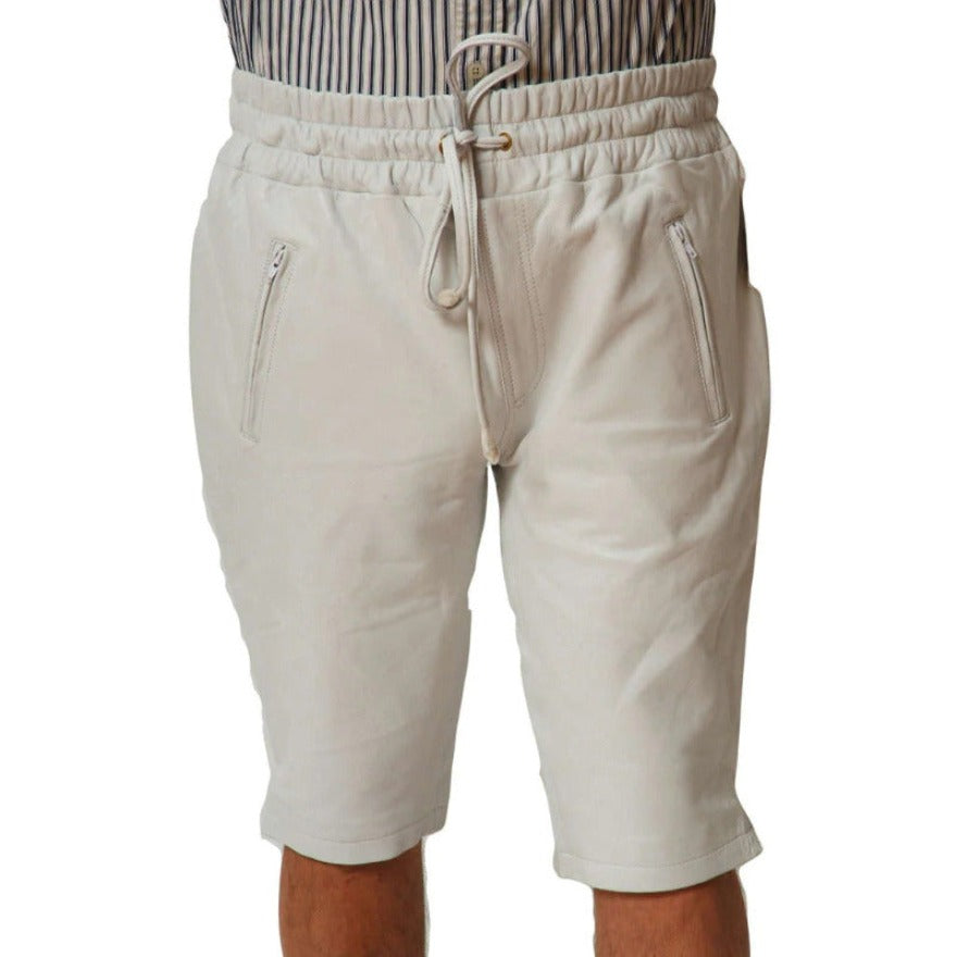 Picture of a model wearing Mens White Leather Shorts, front view.