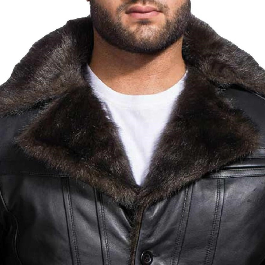 Model wearing a black shearling leather coat, close up view.