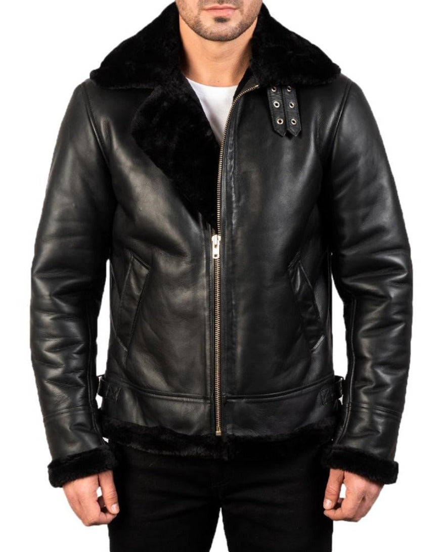 Model wearing Men&#39;s Black Leather Shearling Jacket with black shearling liner. Front view half zippped up.