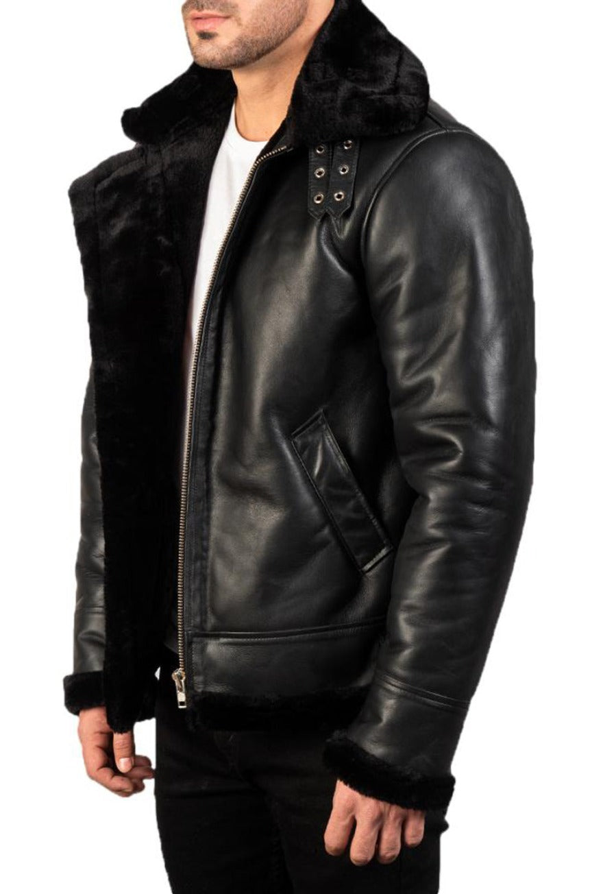 Model wearing Men&#39;s Black Leather Shearling Jacket    with black shearling liner. Side view not zippped up.