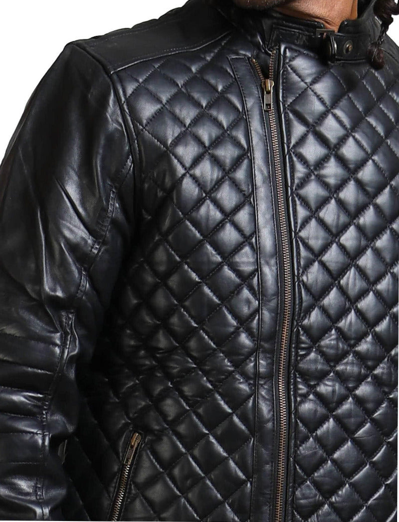 Model wearing a mens padded leather jacket with a diamond pattern, black color, close up view of pattern.