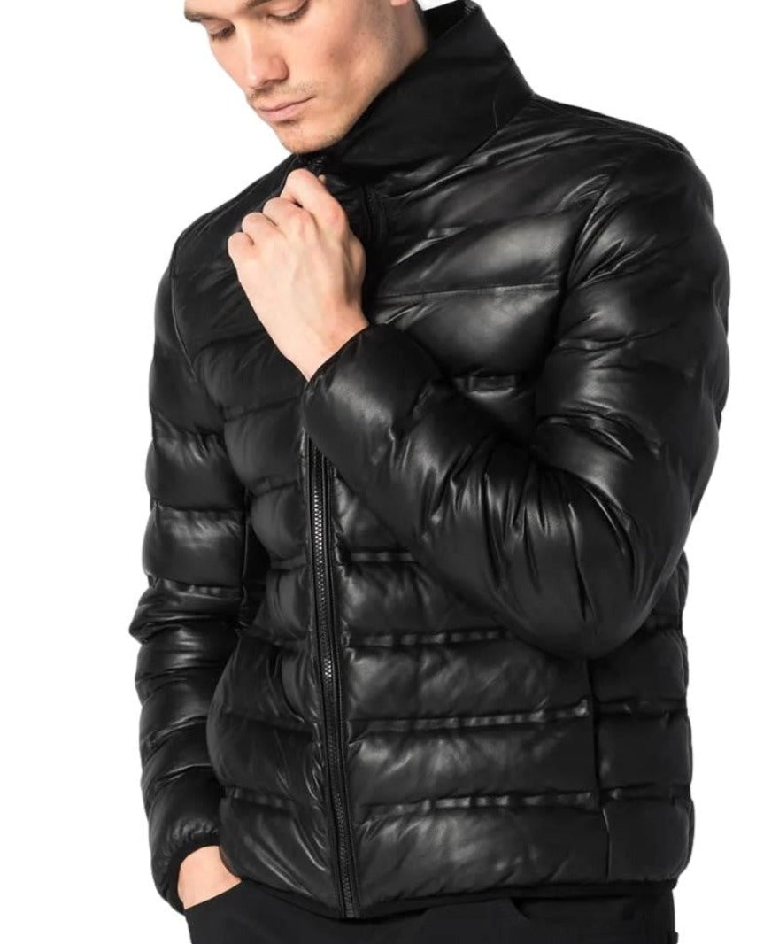Picture of  model wearing mens leather padded jacket in black with narrow rectanglar pattern.  Close up  view.