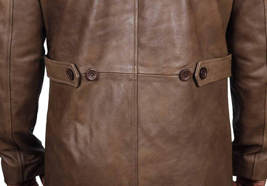 Picture of a model wearing our mens leather trench coat full length . Light brown  color, close up of the back belt.
