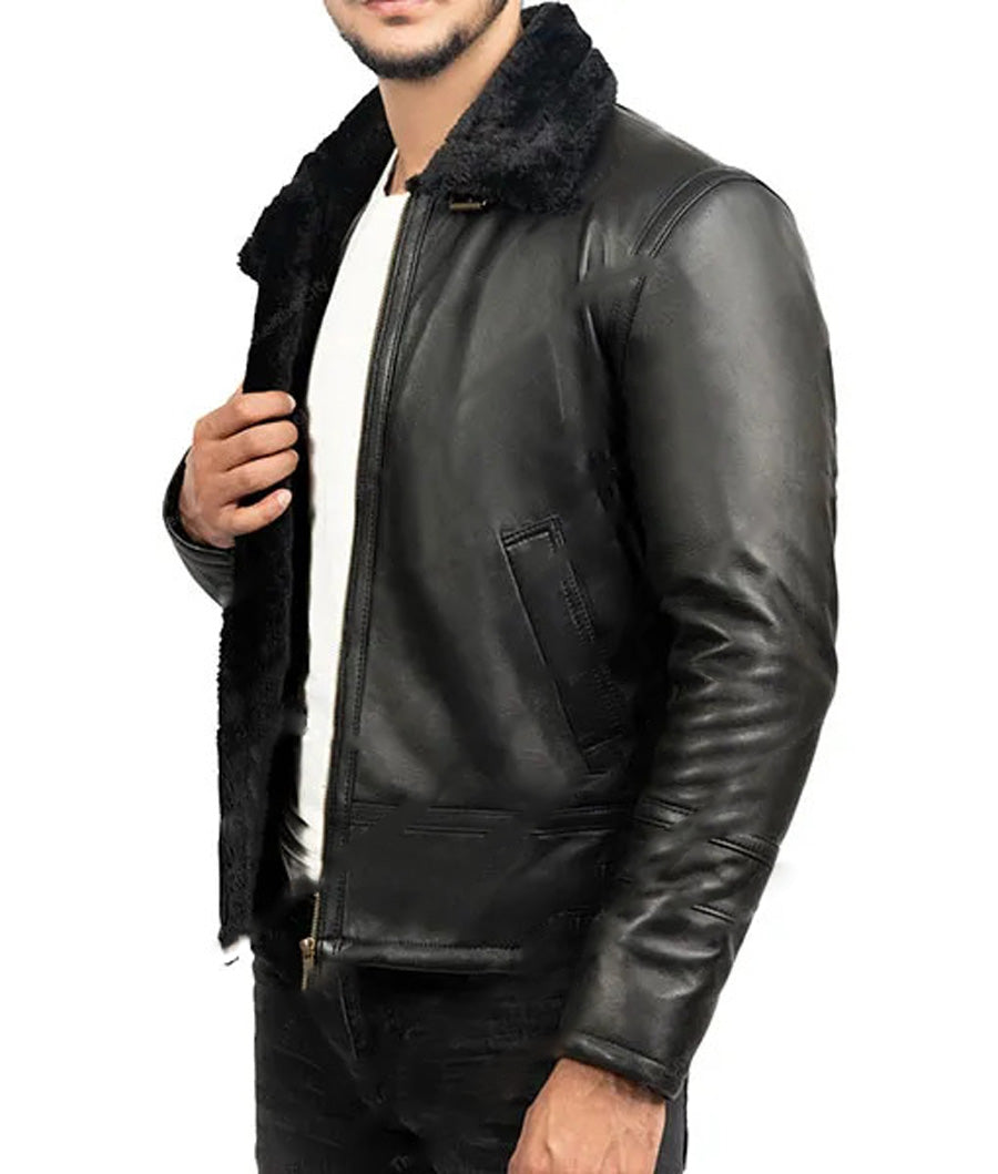 Front view of model wearing black shearling leather aviator jacket.
