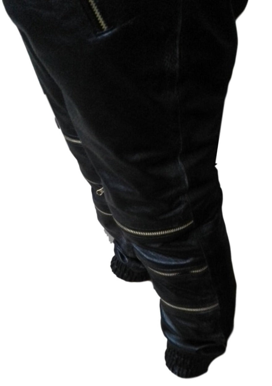 Picture of a model wearing our Black Snakeskin Pants Mens with 3 knee zippers, close up leg  view.