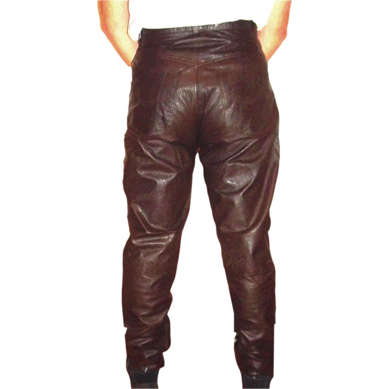picture of a model wearing Brown Snakeskin Leather Jeans, back view.