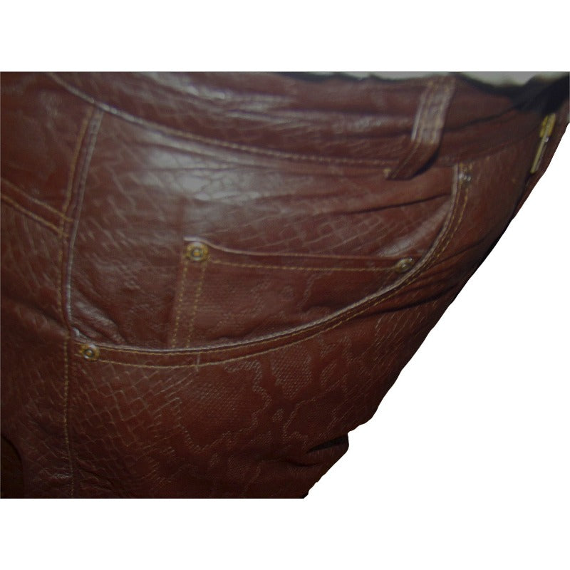 picture of a model wearing Brown Snakeskin Leather Jeans, close up view. of the pocket, showing snakeskin pattern