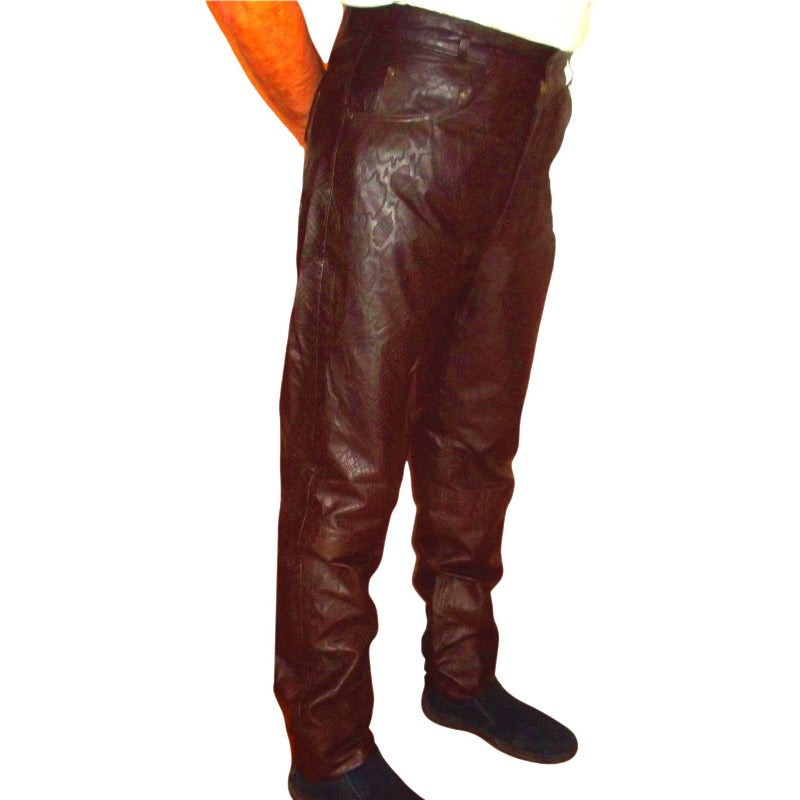 picture of a model wearing Brown Snakeskin Leather Jeans, side view.